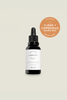 Vibrant Beauty skincare dropper bottle with Clean + Conscious Award badge on a beige background