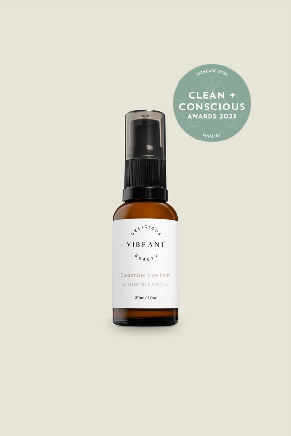 Delicious Vibrant Beauty skincare bottle with a 'Clean + Conscious' award badge on a beige background