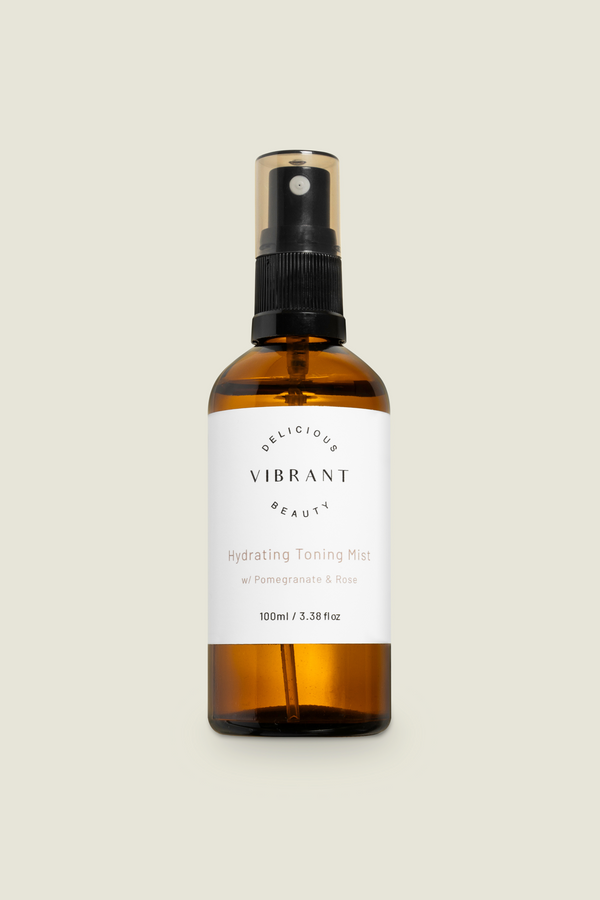 A brown glass bottle with a spray nozzle, labelled as 'Hydrating Toning Mist' 
