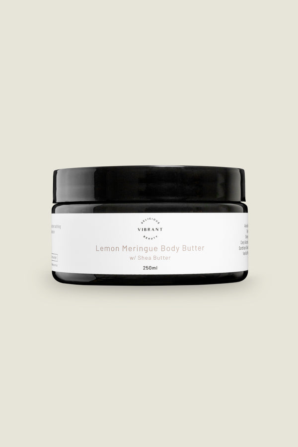 A jar of Lemon Meringue Body Butter with a white label on a light background.