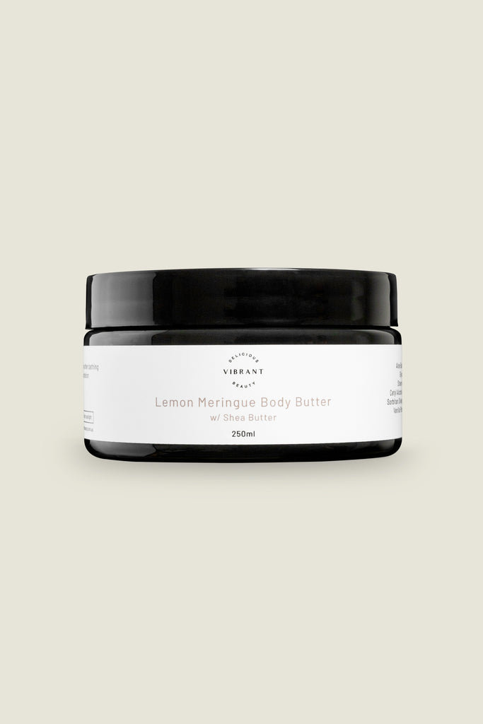 A jar of Lemon Meringue Body Butter with a white label on a light background.