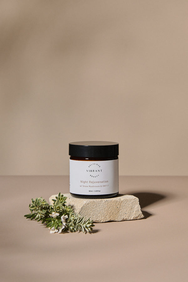 Night Rejuvenation with a label on a beige surface with greenery
