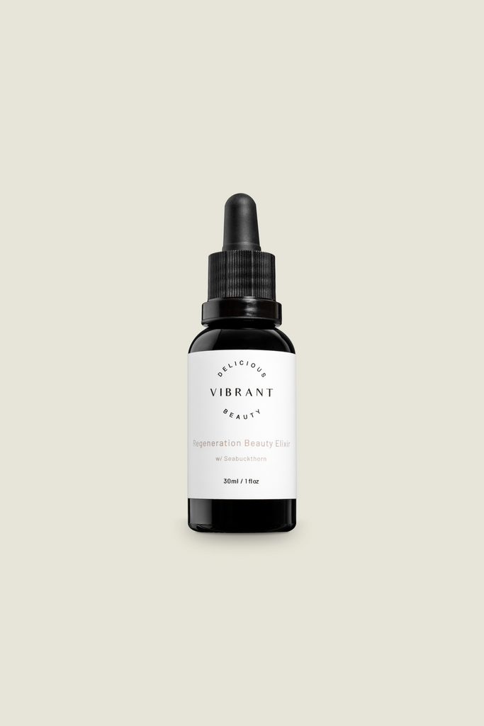 A black glass dropper bottle with a white label, containing Regeneration Beauty Elixir.